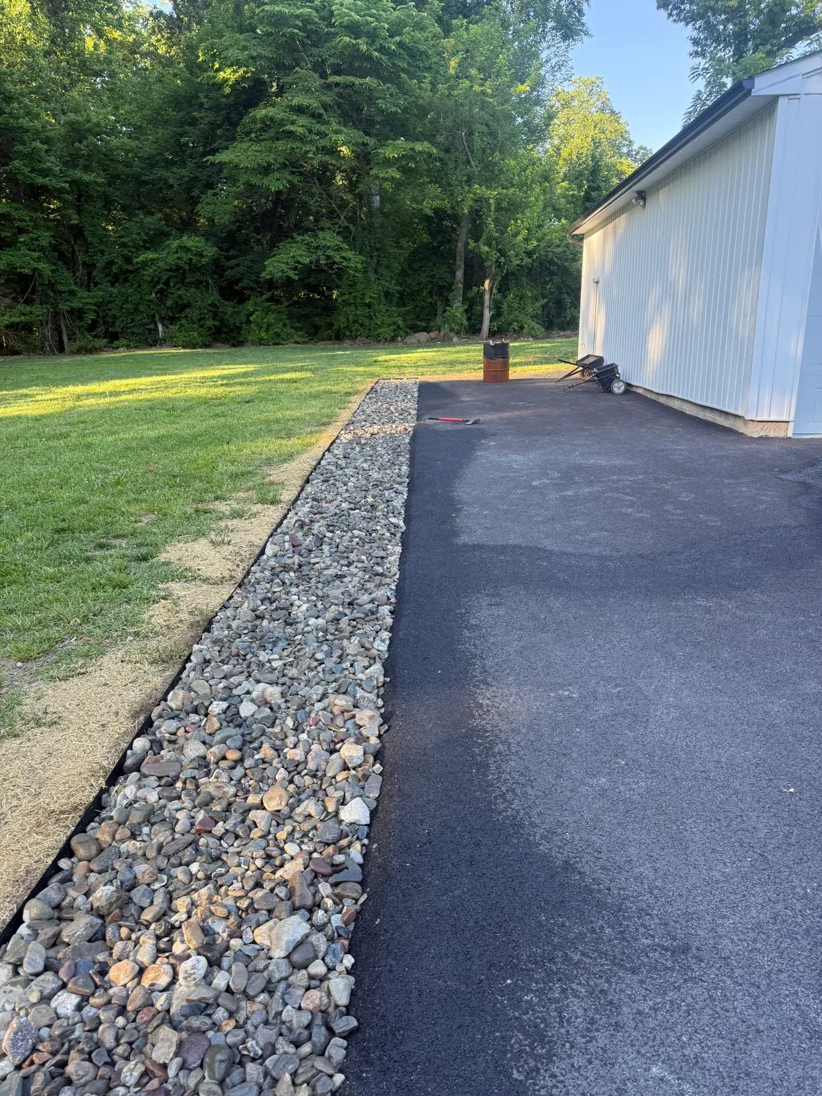 Crushed stone driveway with landscape fabric edging and gravel base installation